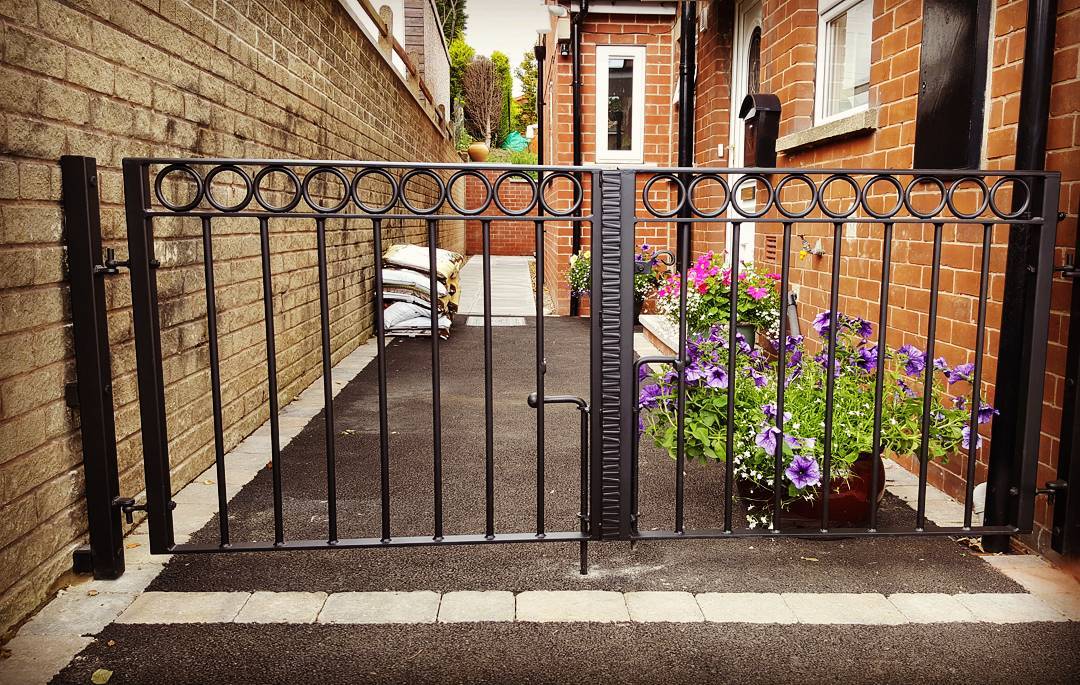 wrought iron driveway gates with rings detail