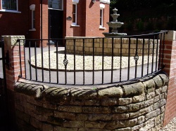 Curved wrought iron metal railings